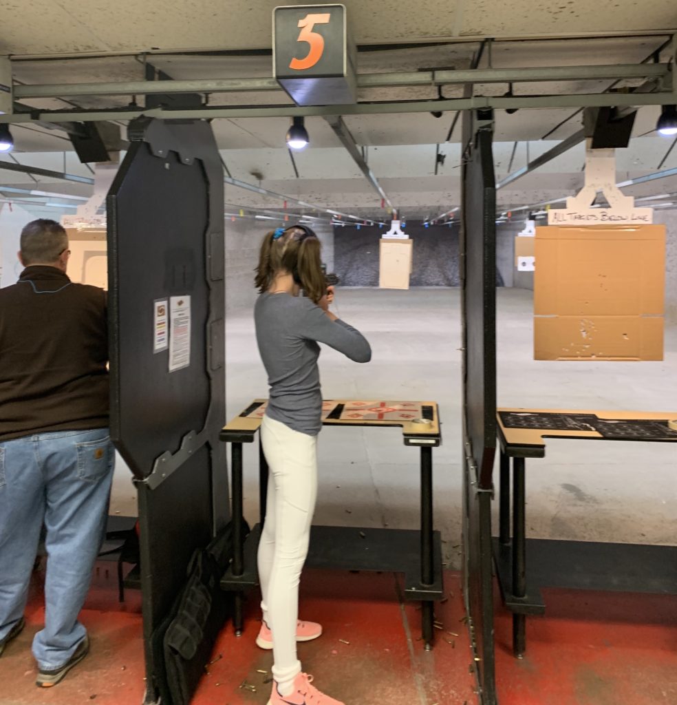 Image of girl at indoor shooting range